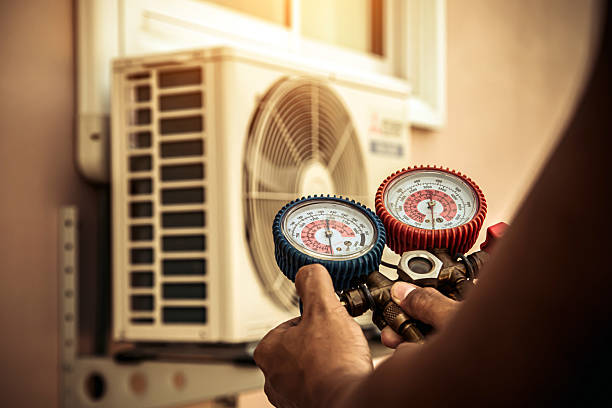 Professional Heat Pump Repair technician working in Cedar Park, TX